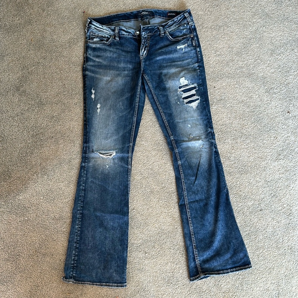 Ripped, acid wash, flare silver jeans